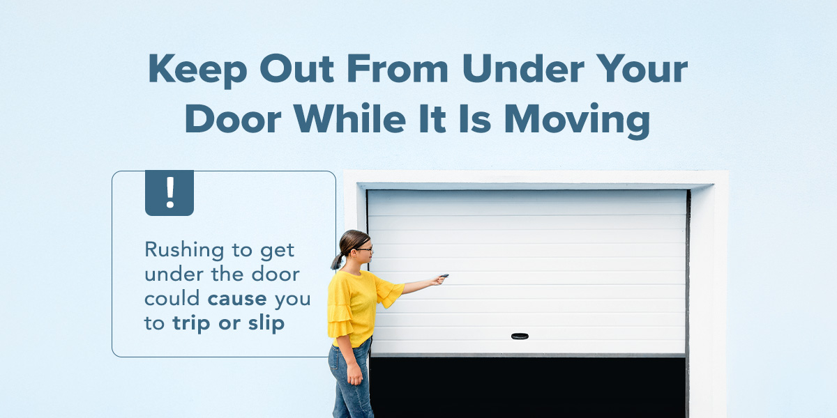 Woman standing back while closing the garage door with a remote